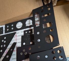 Sheet metal replacements for hardboard panels