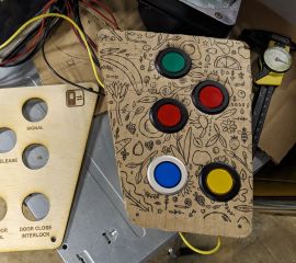 Laser-cut wood door panel next to cardboard prototype