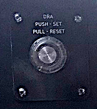 Prototypical DRA button from a Class 80x train cab (highly edited image crop to try to see details)
