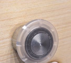 Simulated (but accurate!) DRA button embedded in laser-cut plywood