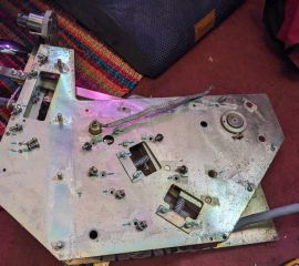 Metal Class 365 Power/Brake Controller on its side, with cable, springs, and unscrewed fasteners visible