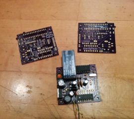 Two blank PartyMode 2.0 low-power PCBs and one partially-populated board.